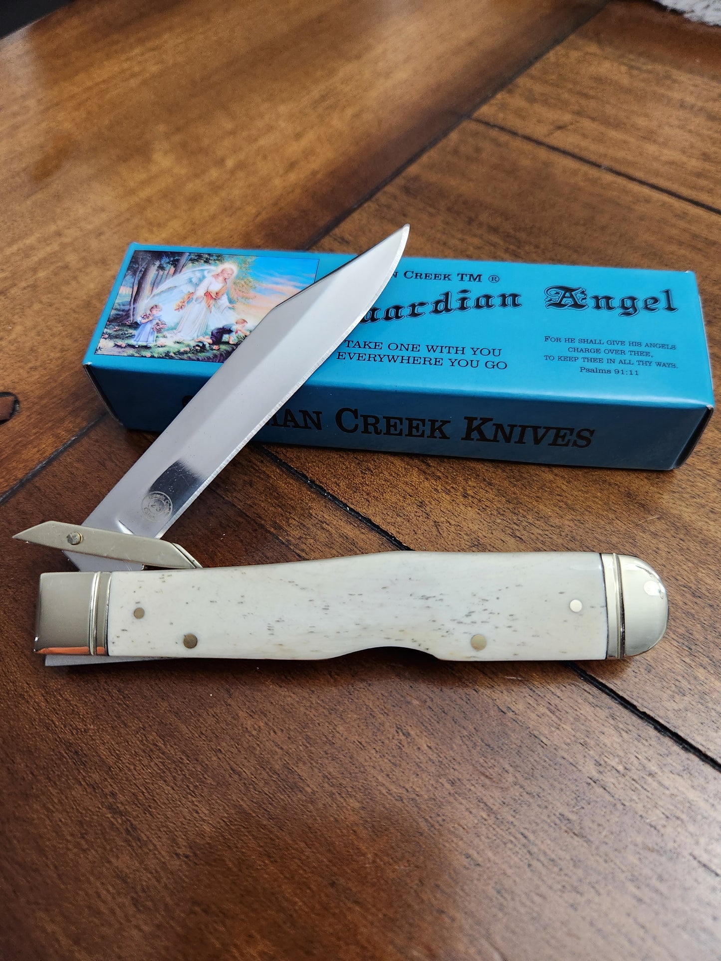 Guardian Angel Lock Back Cheetah Knife White Bone Handles 4 3/8" EM2567052WBN